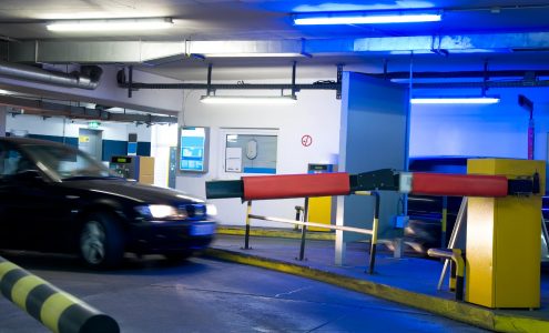 car driving in a parking garage with blue light
